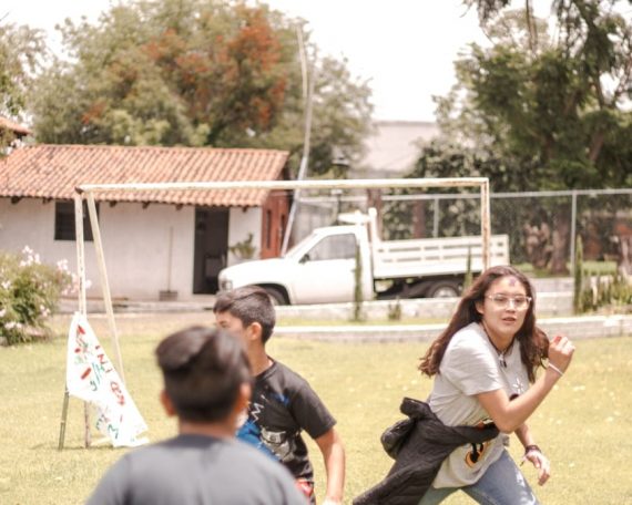 a group of people playing in a yard